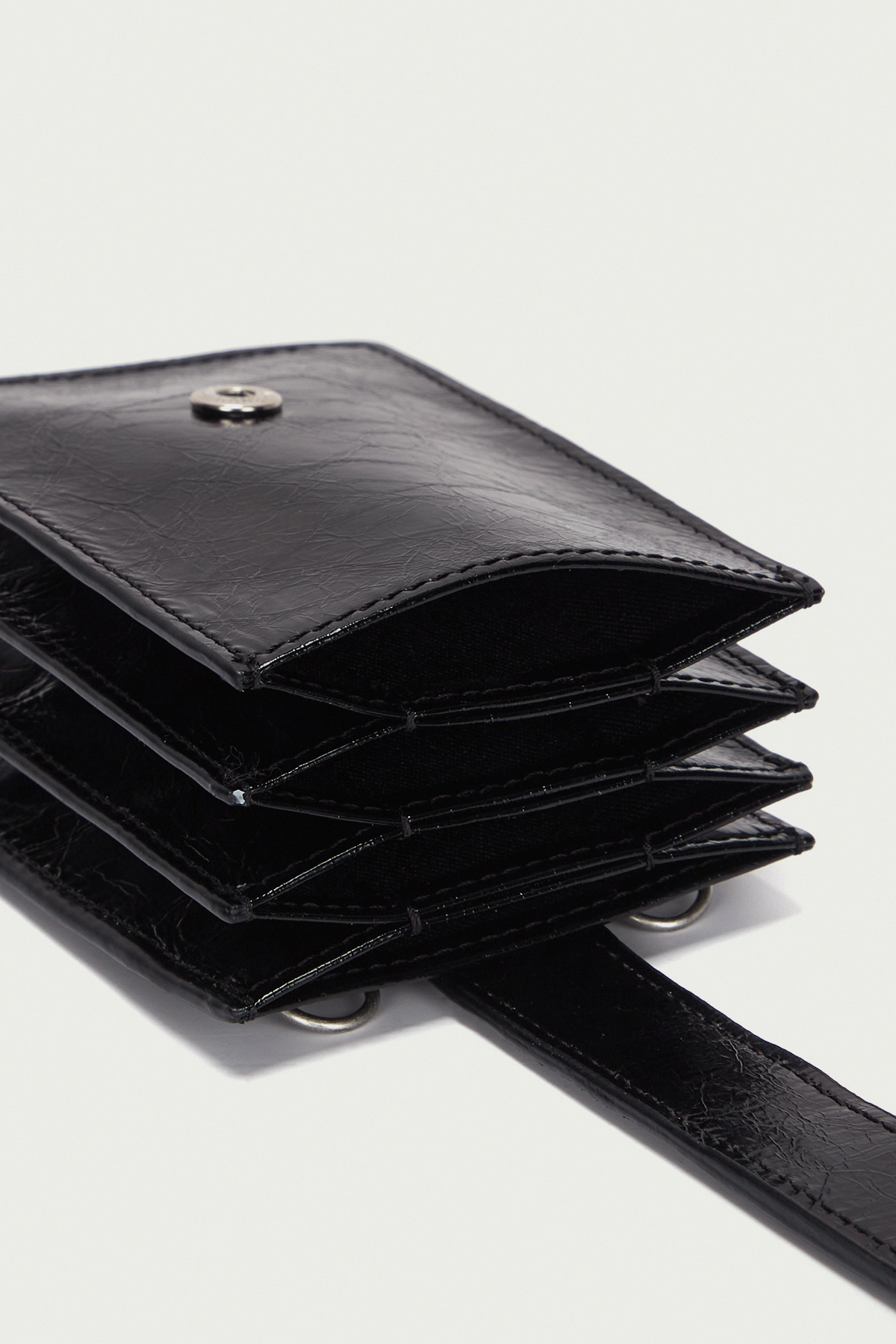 ACCORDION NECKLACE WALLET IN BLACK - MATINKIM